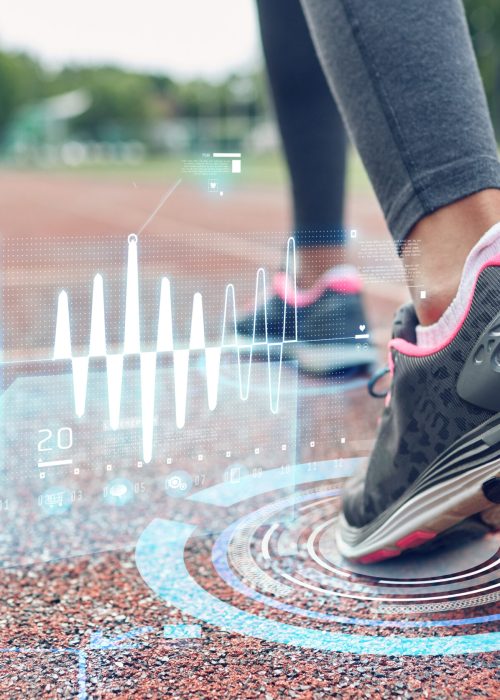 fitness, sport, training, people and healthy lifestyle concept - close up of woman feet running on track with futuristic holograms from back